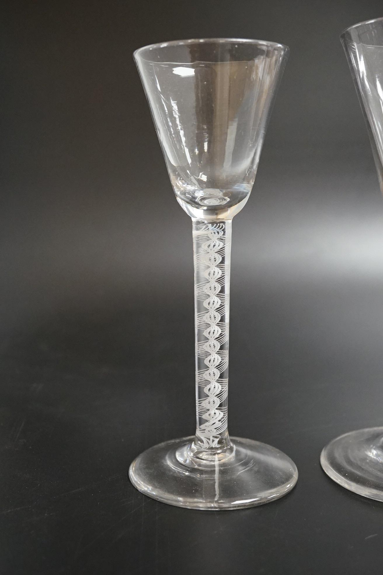 Two DSOT stem wine glasses, c.1760, with funnel shaped bowls, tallest 16.5cm high